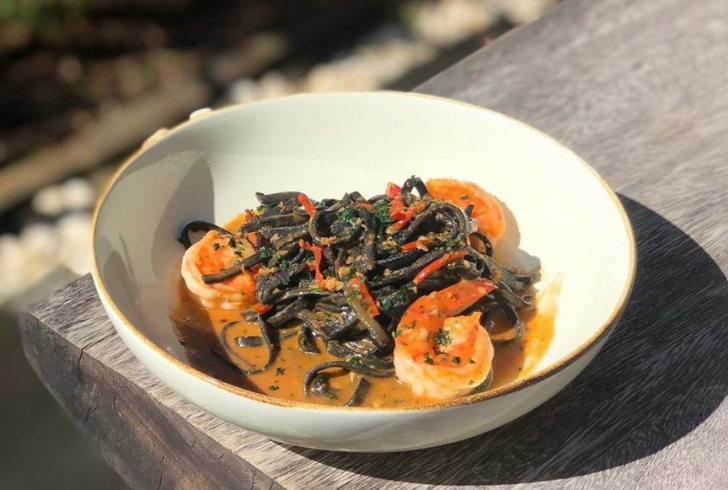 A subtle white wine sauce lets the seafood and unique squid ink pasta shine.