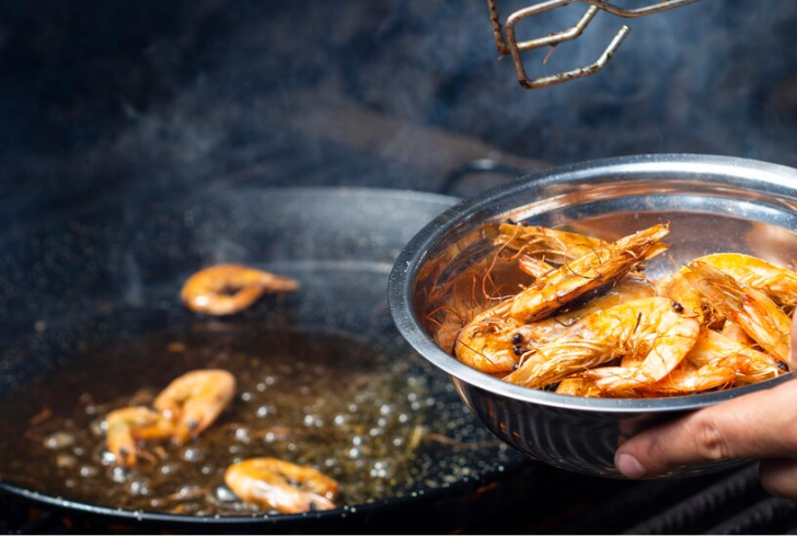 In a skillet, heat olive oil and sauté shrimp over medium-high heat until opaque